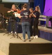 SuperMuso Violin group playing