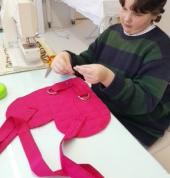 One of our tweens making an awesome geart-shaped backpack.