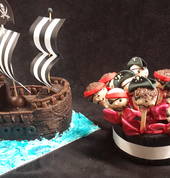 Land Ahoy! Pirate popcakes and and pirate ship cake