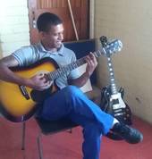 Student practicing his guitar scales