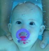 Olivia at 9 months old under the water. Very calm and comfortable under the water.