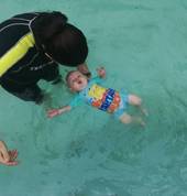 Ashleigh teaching Lincoln 6 months old to float.